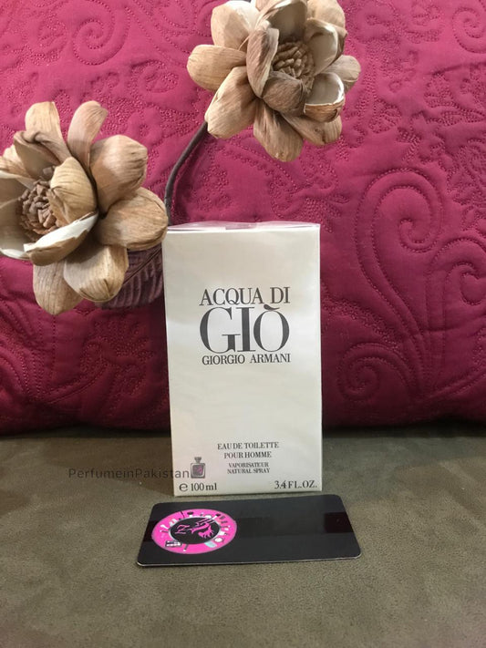 Acqua di Giò Eau de Toilette 100ml by Giorgio Armani displayed with decorative wooden flowers and PerfumeinPakistan branding card
