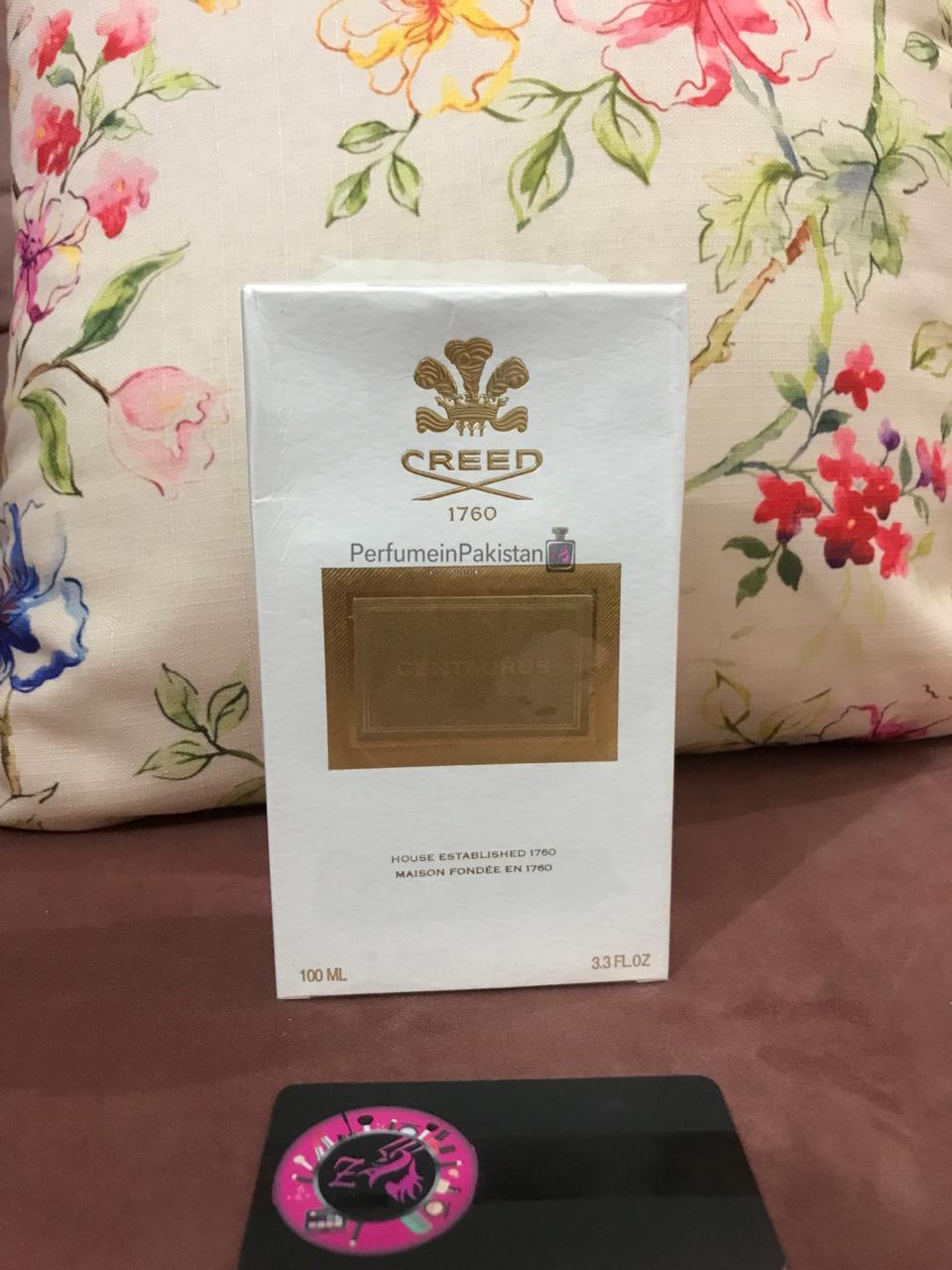 Creed Centaurus Eau de Parfum 100ml perfume box displayed with Perfume in Pakistan by Zainab authenticity card on a floral background.