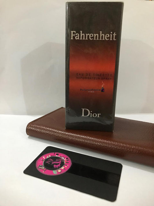 Dior Fahrenheit Eau de Toilette perfume box displayed on a brown leather accessory