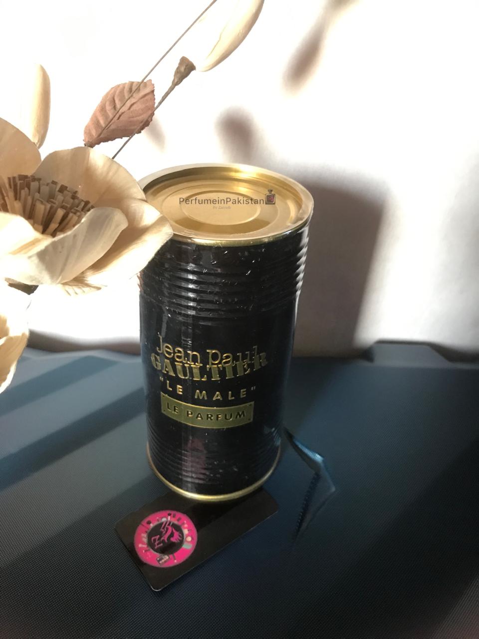 Jean Paul Gaultier Le Male Le Parfum 125ml men's perfume collector tin displayed on a dark surface with decorative flowers and Perfume in Pakistan branding