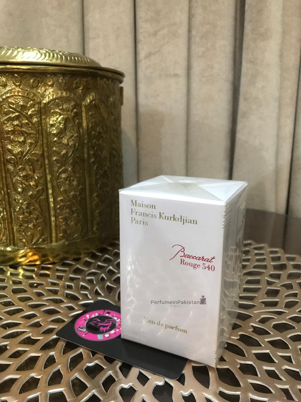 Maison Francis Kurkdjian Baccarat Rouge 540 Eau de Parfum perfume box displayed on decorative metallic table with Perfume in Pakistan branding card