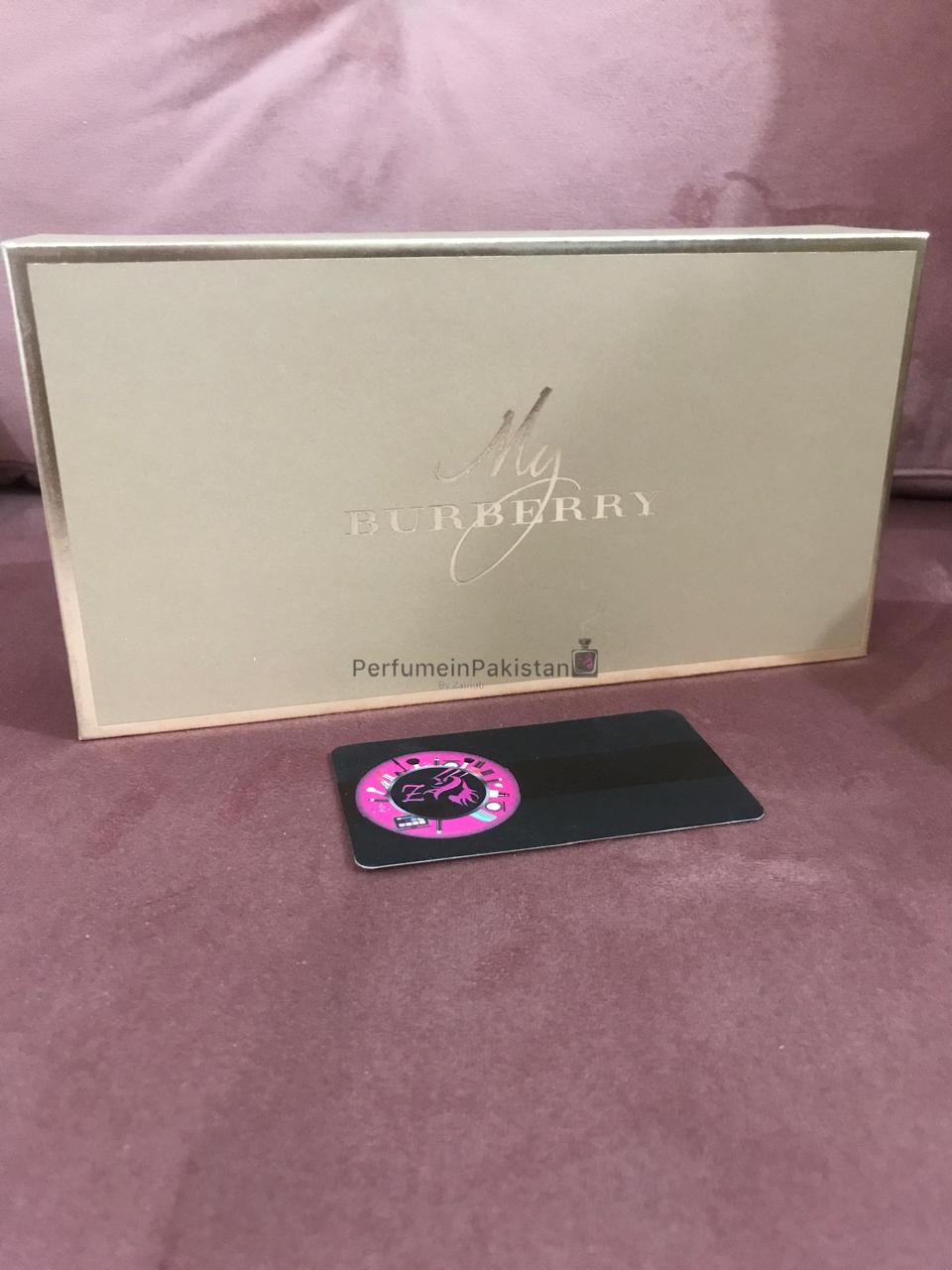 Burberry My Burberry women's perfume gift set box displayed with Perfume in Pakistan branding card on a pink velvet background