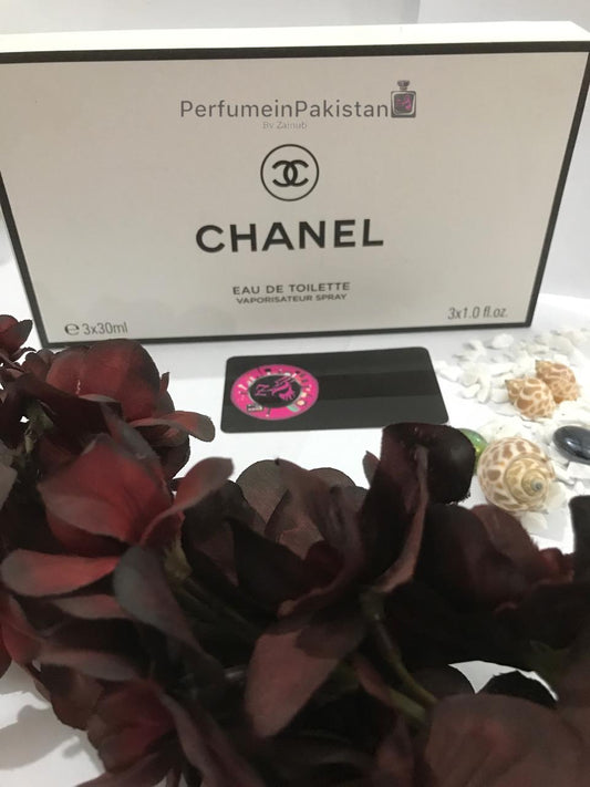 Chanel Eau de Toilette Gift Set 3 x 30ml displayed with decorative flowers, shells, and Perfume in Pakistan branding card