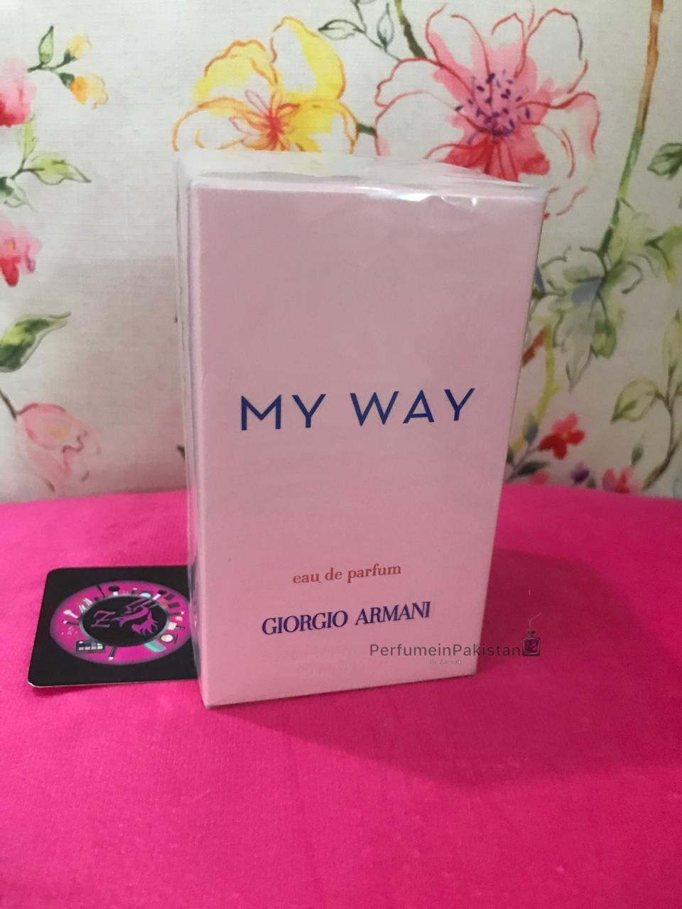Giorgio Armani My Way Eau de Parfum perfume box displayed on a pink velvet surface with floral background and PerfumeinPakistan branding card