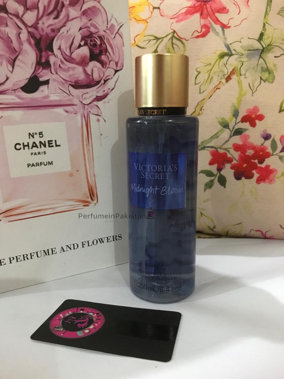 Victoria's Secret Midnight Bloom Fragrance Mist 250ml bottle displayed with floral decor and PerfumeinPakistan branding