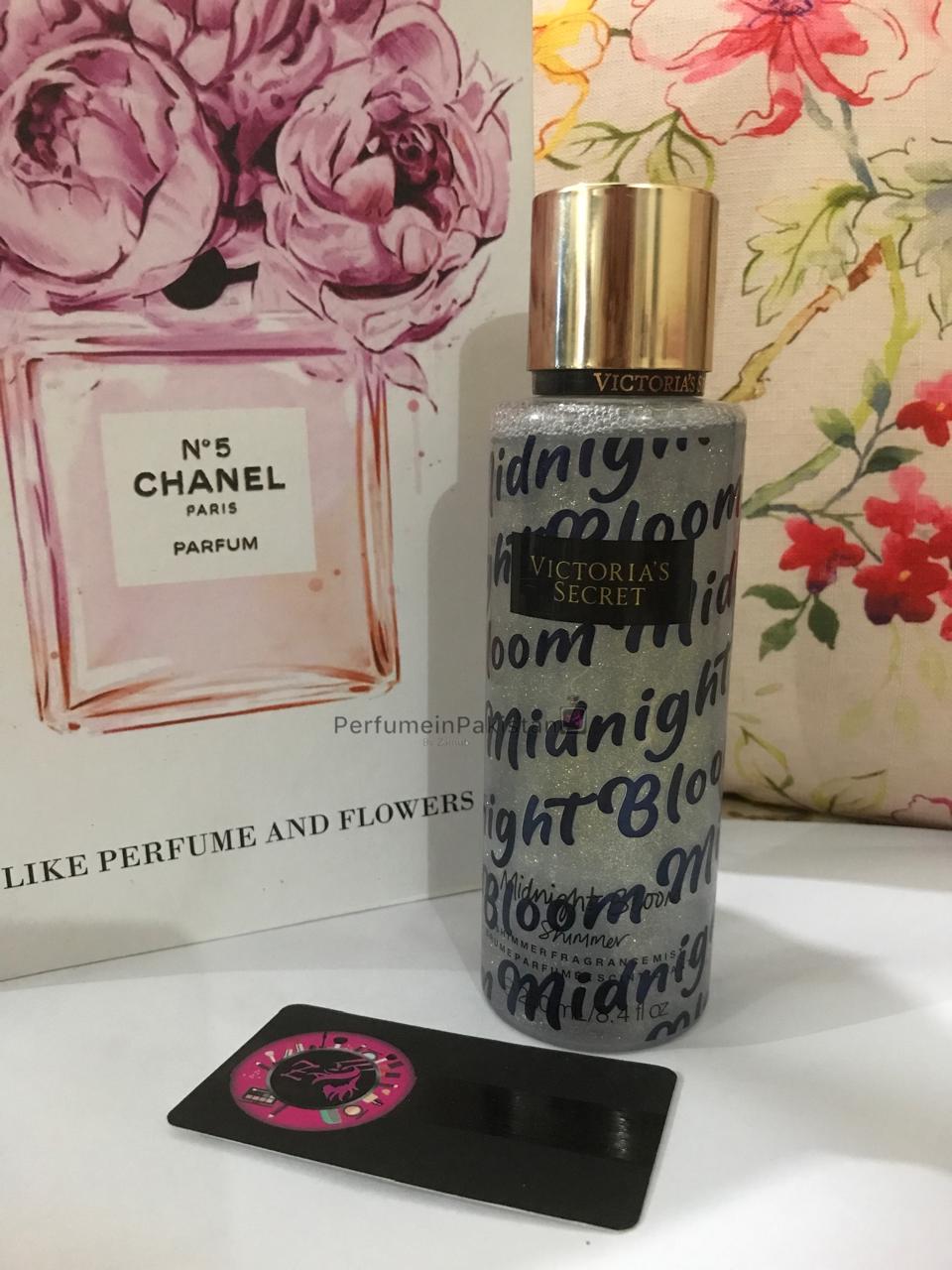 Victoria's Secret Midnight Bloom Shimmer Fragrance Mist 250ml bottle displayed with floral decorative background for women.