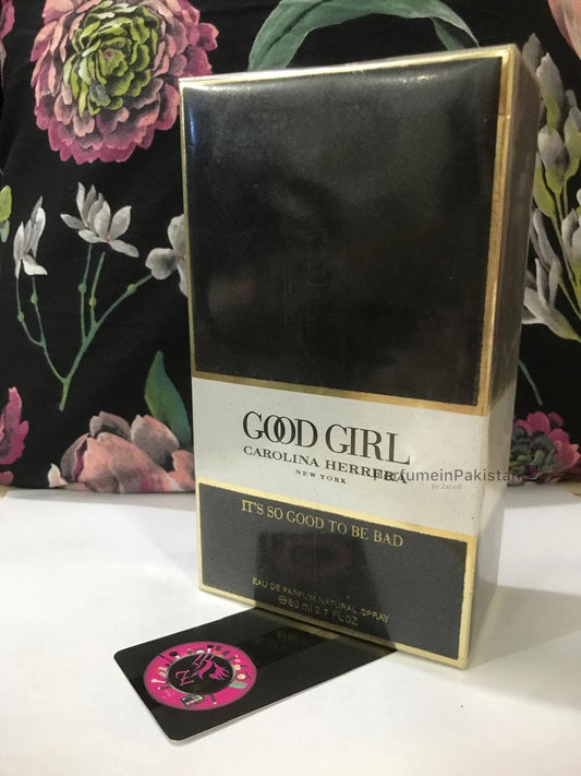 Carolina Herrera Good Girl Eau de Parfum 80ml perfume box displayed with floral background and PerfumeinPakistan branding card
