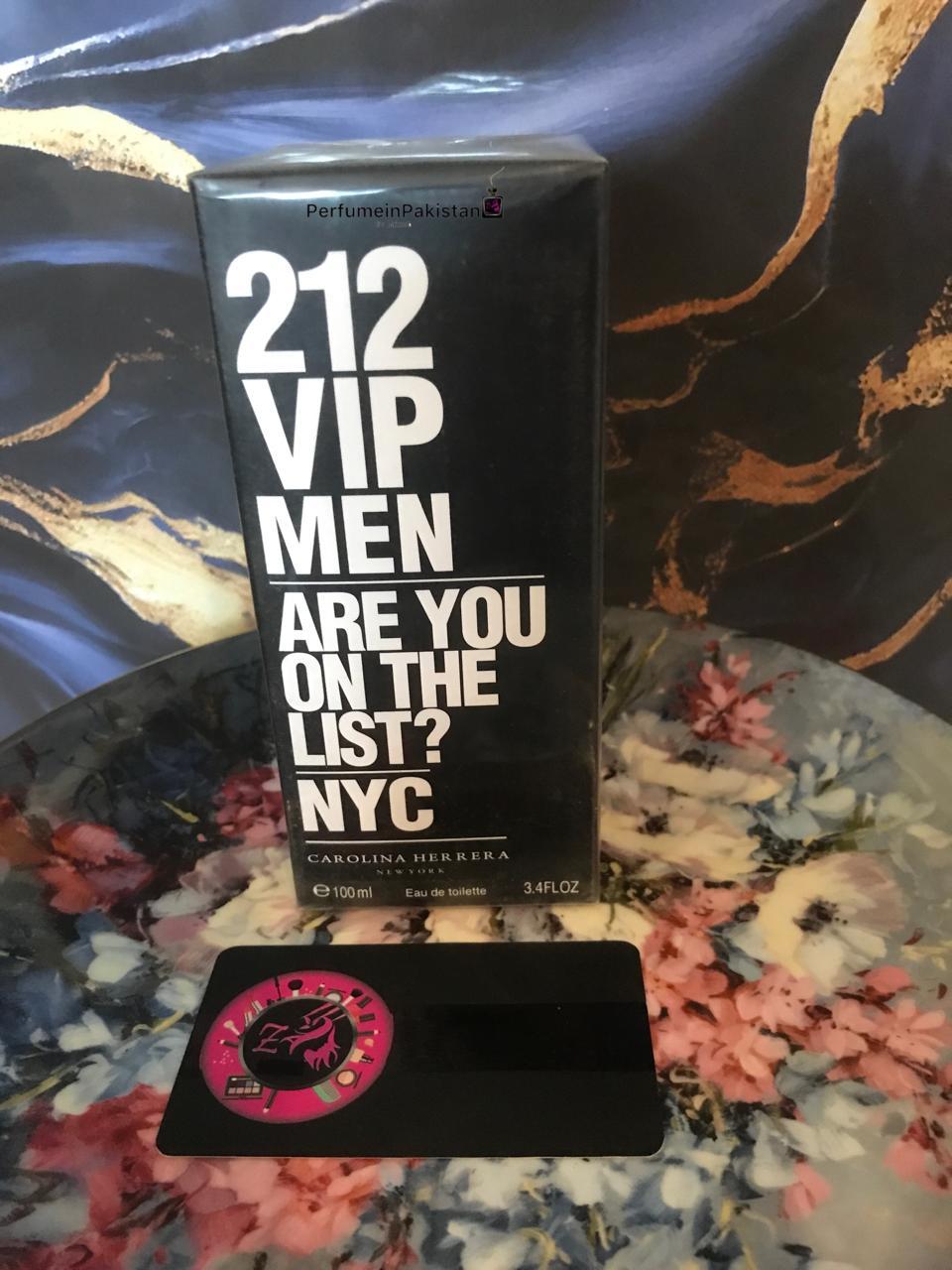 212 VIP Men by Carolina Herrera Eau de Toilette 100ml perfume box displayed with PerfumeinPakistan branding card against a black and gold marble-style background.
