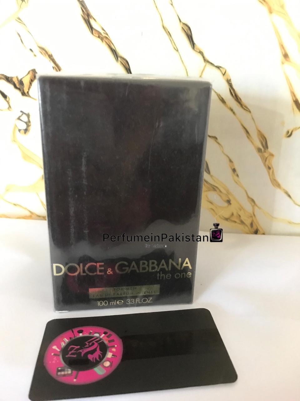 Dolce & Gabbana The One For Men Eau de Parfum Intense 100ml perfume box displayed on a white surface with a marble-pattern background and PerfumeinPakistan branding.