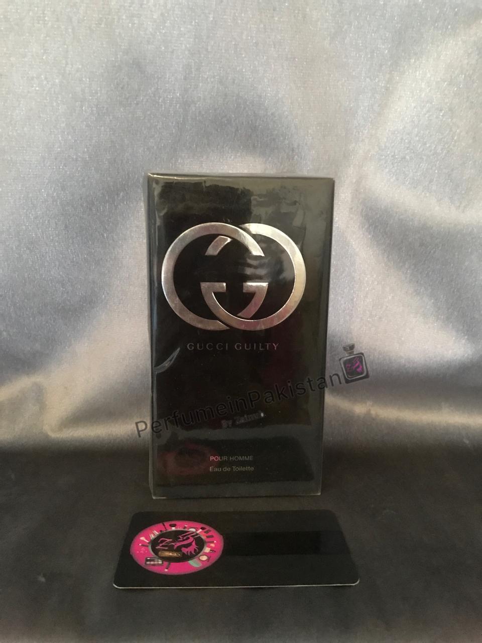 Gucci Guilty Pour Homme Eau de Toilette 100ml perfume box displayed on a dark reflective surface with silver backdrop and PerfumeinPakistan branding.