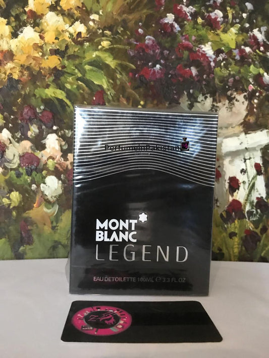 Mont Blanc Legend Eau de Toilette 100ml perfume box displayed on a white surface with a floral art background and PerfumeinPakistan branding.