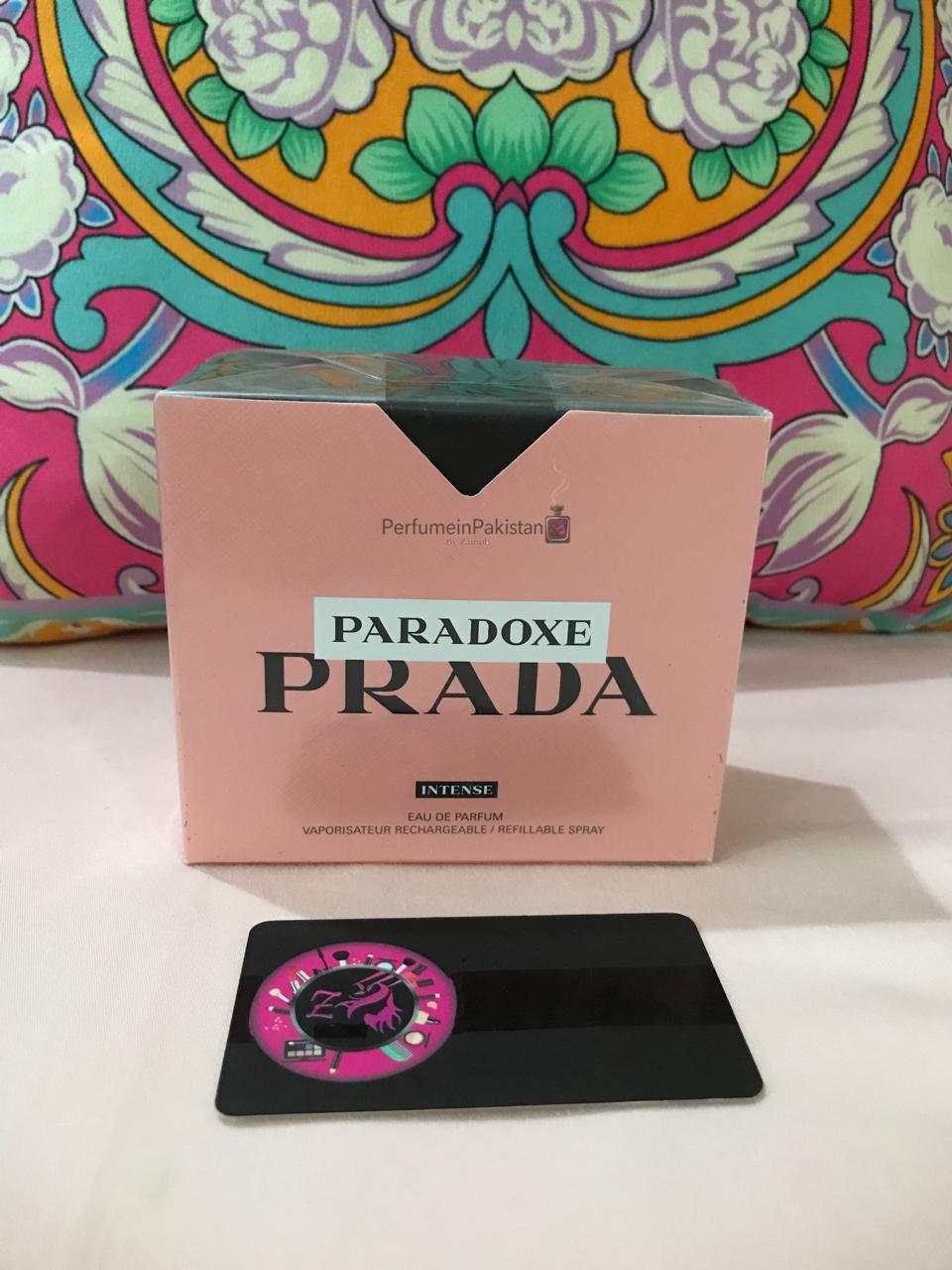 Prada Paradoxe Intense Eau de Parfum box displayed with Perfume in Pakistan branding.