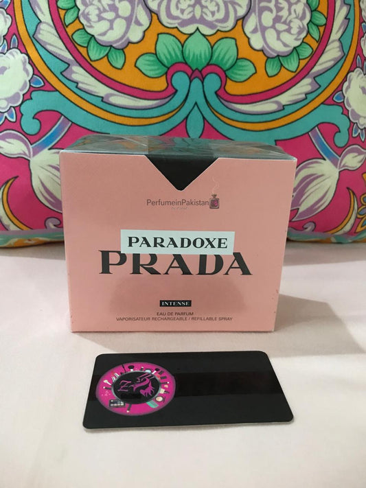 Prada Paradoxe Intense Eau de Parfum box displayed with Perfume in Pakistan branding.